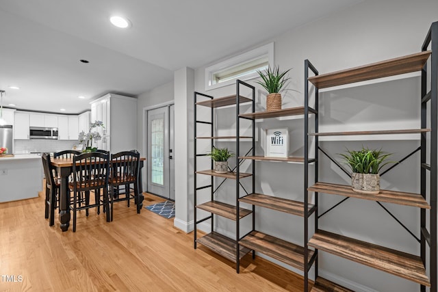 5208 Melbourne Rd, Raleigh, NC 27606 - dining area with light wood-style flooring and recessed lighting