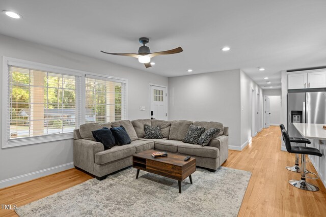 5208 Melbourne Rd, Raleigh, NC 27606 - living area featuring light wood-style flooring, ceiling fan, baseboards, and recessed lighting