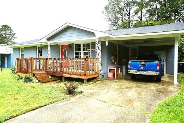 ranch-style home featuring concrete driveway, brick siding, a porch, and a carport