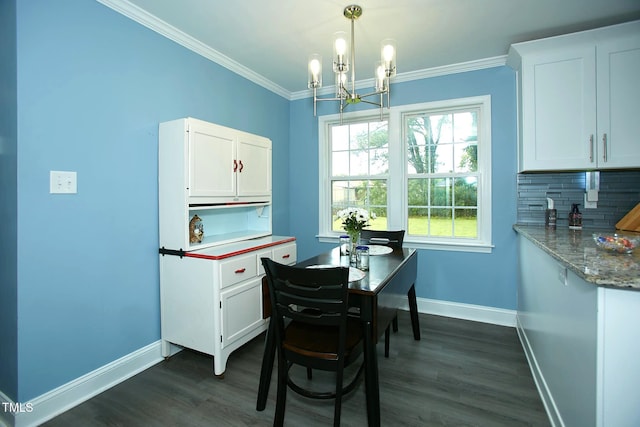 dining area featuring baseboards, dark wood finished floors, a chandelier, crown molding, and a desk