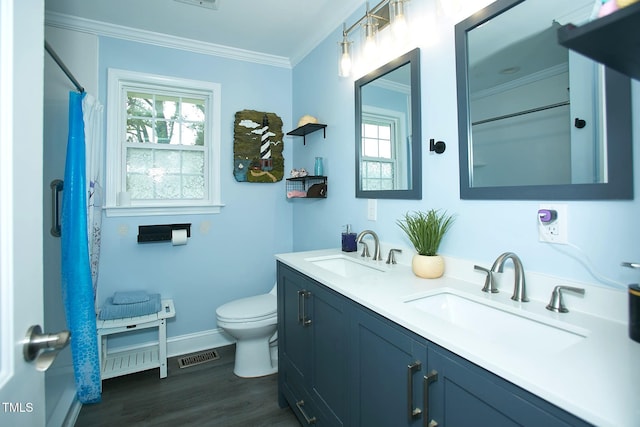 full bath featuring ornamental molding, toilet, baseboards, wood finished floors, and double vanity