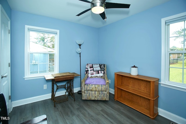 sitting room featuring healthy amount of natural light, wood finished floors, and a ceiling fan