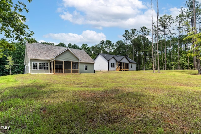 1412 Sagamore Dr, Louisburg, NC 27549 - back of house with a sunroom and a yard