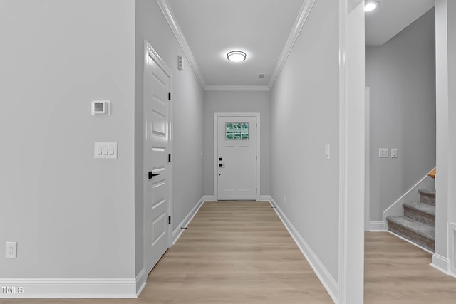 1412 Sagamore Dr, Louisburg, NC 27549 - doorway to outside with crown molding, light wood-style flooring, and stairs