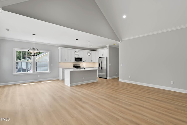 1412 Sagamore Dr, Louisburg, NC 27549 - unfurnished living room with recessed lighting, light wood-style flooring, a chandelier, crown molding, and vaulted ceiling