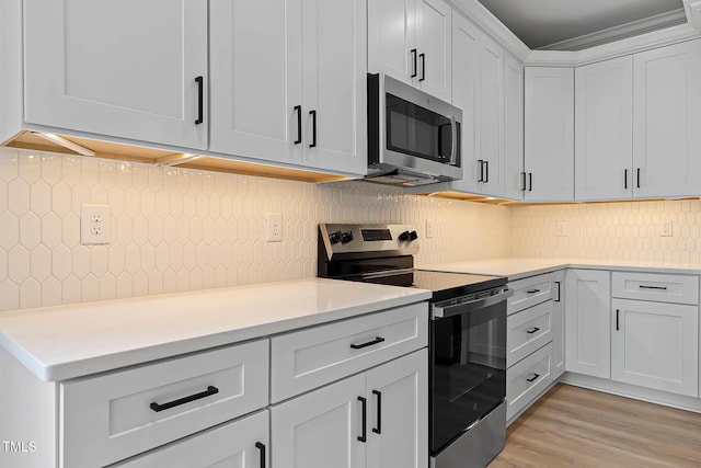 1412 Sagamore Dr, Louisburg, NC 27549 - kitchen with stainless steel appliances, tasteful backsplash, and light countertops