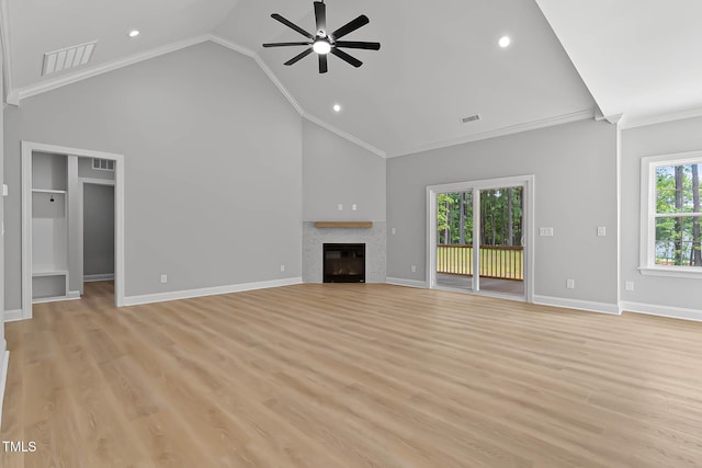 1412 Sagamore Dr, Louisburg, NC 27549 - unfurnished living room with ceiling fan, crown molding, a tile fireplace, light wood-type flooring, and recessed lighting