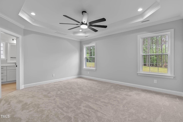 1412 Sagamore Dr, Louisburg, NC 27549 - unfurnished room with a raised ceiling, ornamental molding, light carpet, plenty of natural light, and a ceiling fan
