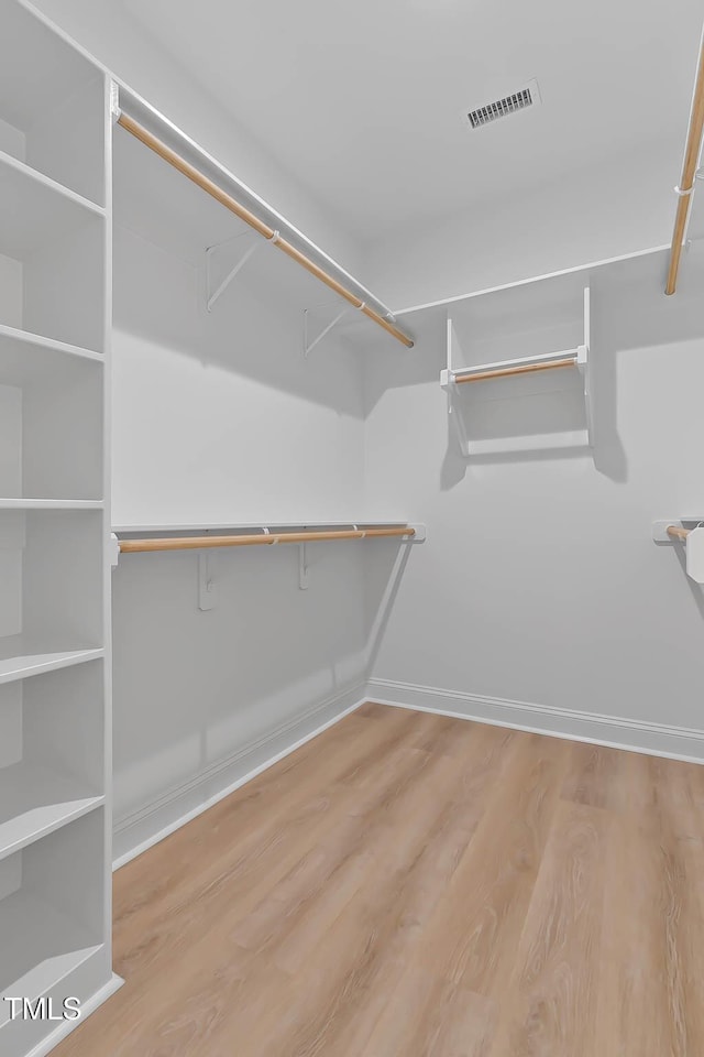 1412 Sagamore Dr, Louisburg, NC 27549 - walk in closet featuring wood finished floors