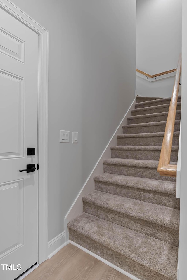 1412 Sagamore Dr, Louisburg, NC 27549 - stairway with baseboards and wood finished floors