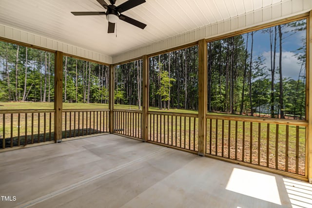 1412 Sagamore Dr, Louisburg, NC 27549 - unfurnished sunroom featuring ceiling fan, healthy amount of natural light, and view of wooded area
