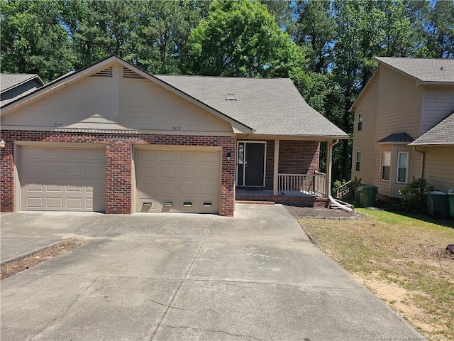 5472 Robmont Dr, Fayetteville, NC 28306 - ranch-style home featuring driveway, brick siding, covered porch, and a garage