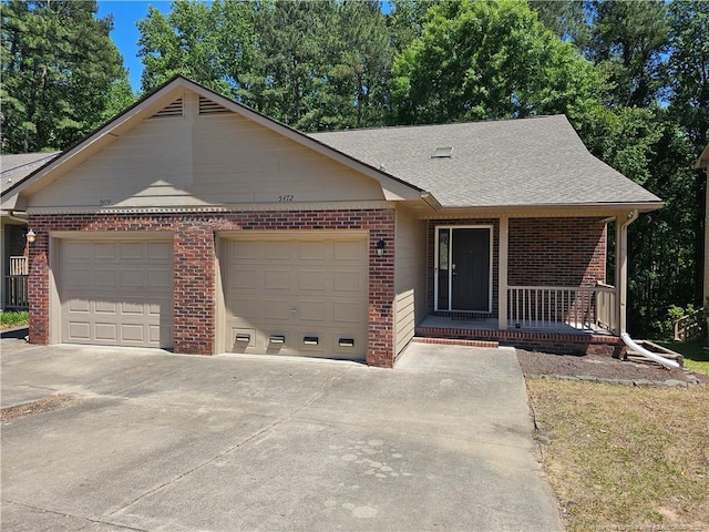 5472 Robmont Dr, Fayetteville, NC 28306 - ranch-style house with a porch, roof with shingles, a garage, and brick siding