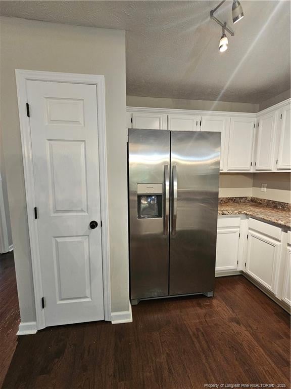 5472 Robmont Dr, Fayetteville, NC 28306 - kitchen with white cabinets, rail lighting, stainless steel refrigerator with ice dispenser, and dark wood-style floors