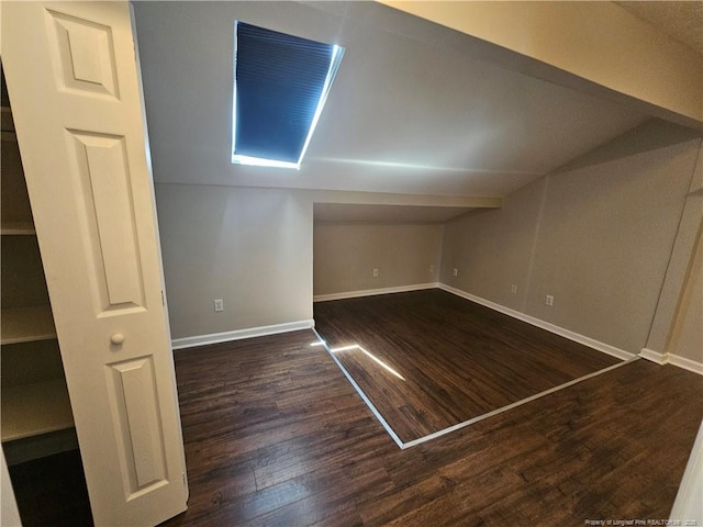 5472 Robmont Dr, Fayetteville, NC 28306 - bonus room featuring lofted ceiling, baseboards, and wood finished floors