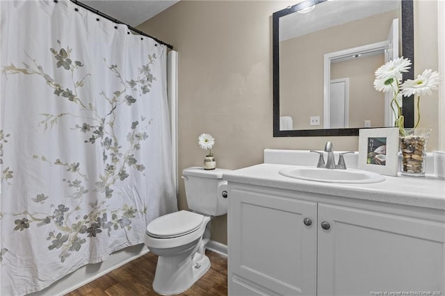 6750 Weeping Water Run, Fayetteville, NC 28314 - bathroom with toilet, wood finished floors, a shower with curtain, baseboards, and vanity