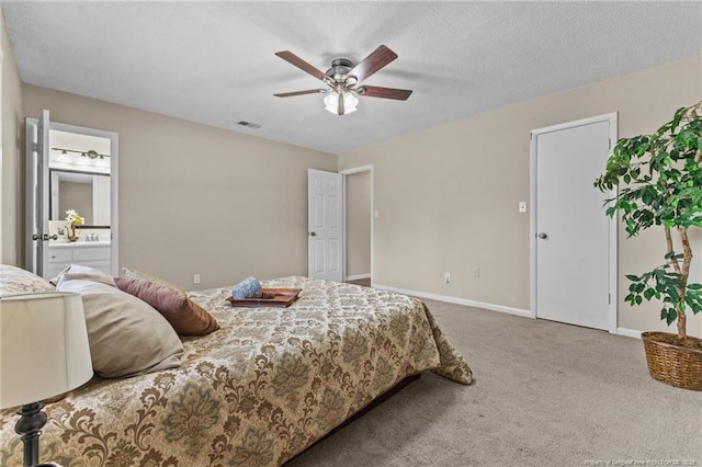 6750 Weeping Water Run, Fayetteville, NC 28314 - carpeted bedroom with connected bathroom, baseboards, a ceiling fan, and visible vents