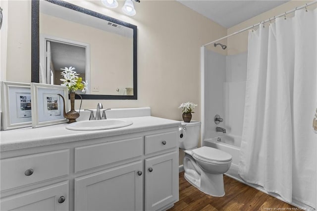 6750 Weeping Water Run, Fayetteville, NC 28314 - full bath featuring toilet, visible vents, vanity, wood finished floors, and shower / bath combo