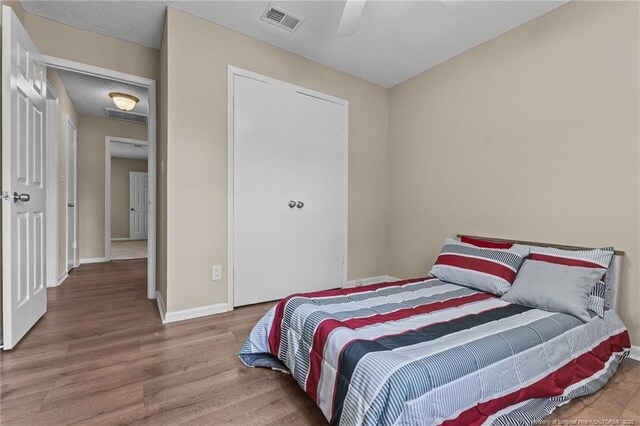 6750 Weeping Water Run, Fayetteville, NC 28314 - bedroom featuring visible vents, wood finished floors, and baseboards