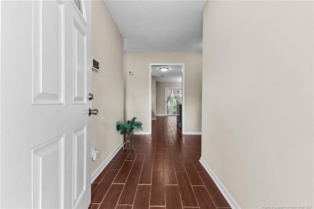 6750 Weeping Water Run, Fayetteville, NC 28314 - corridor with dark wood-style flooring and baseboards