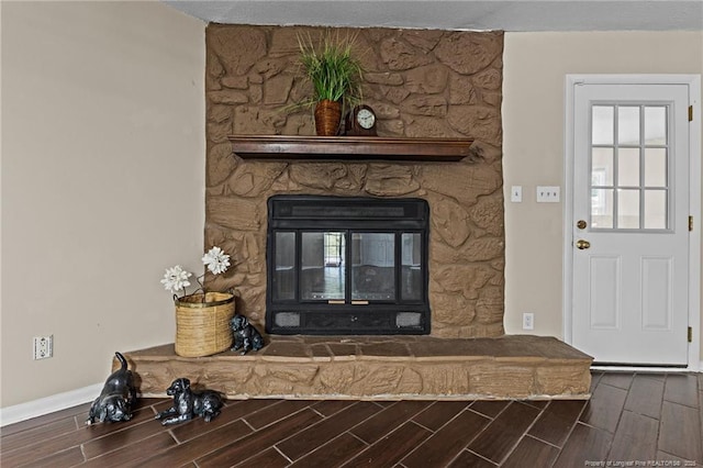 6750 Weeping Water Run, Fayetteville, NC 28314 - room details featuring a stone fireplace, baseboards, and wood finish floors