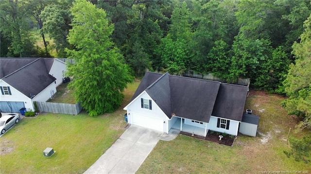 view of subject property featuring a heavily wooded area