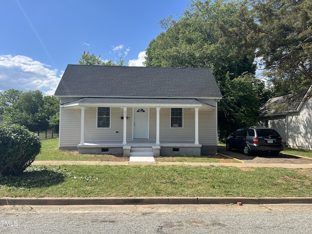 bungalow featuring a porch, a front yard, and crawl space