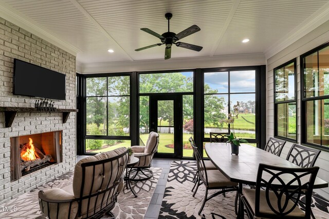 1229 Perry Bluff Dr, Wake Forest, NC 27587 - sunroom / solarium featuring a ceiling fan, a fireplace, and plenty of natural light