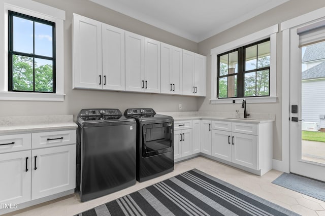 1229 Perry Bluff Dr, Wake Forest, NC 27587 - washroom featuring cabinet space, washer and dryer, crown molding, and light tile patterned floors