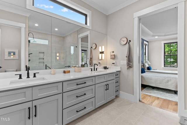 1229 Perry Bluff Dr, Wake Forest, NC 27587 - ensuite bathroom with a shower stall, ornamental molding, double vanity, baseboards, and toilet