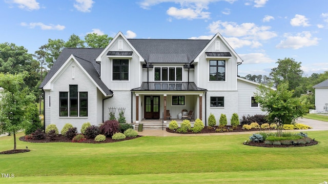 1229 Perry Bluff Dr, Wake Forest, NC 27587 - modern inspired farmhouse featuring board and batten siding, covered porch, a standing seam roof, and a front yard