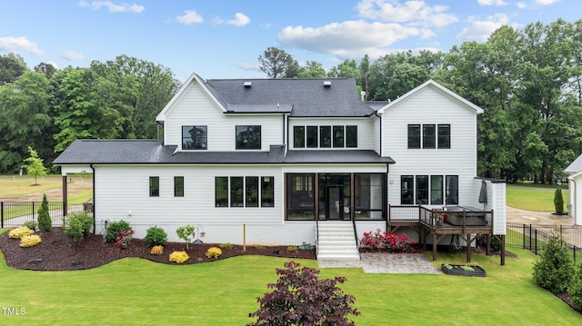 1229 Perry Bluff Dr, Wake Forest, NC 27587 - back of property featuring a sunroom, a shingled roof, stairway, and a deck