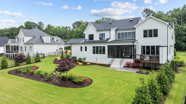 1229 Perry Bluff Dr, Wake Forest, NC 27587 - back of property featuring a sunroom, stairway, and roof with shingles