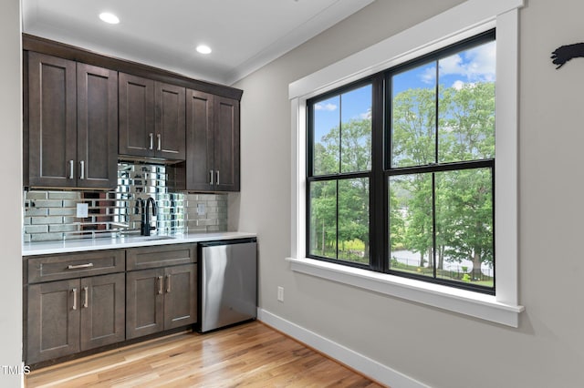 1229 Perry Bluff Dr, Wake Forest, NC 27587 - indoor wet bar with stainless steel dishwasher, plenty of natural light, baseboards, tasteful backsplash, and recessed lighting