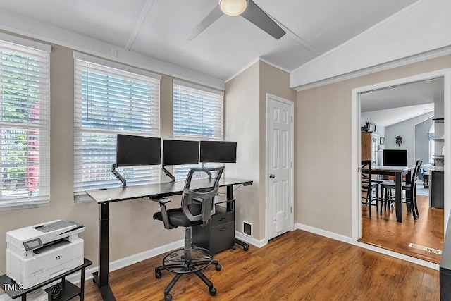 office area featuring ceiling fan, healthy amount of natural light, crown molding, wood finished floors, and baseboards