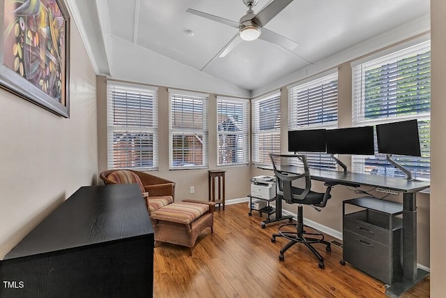 office area featuring a ceiling fan, wood finished floors, vaulted ceiling, and baseboards