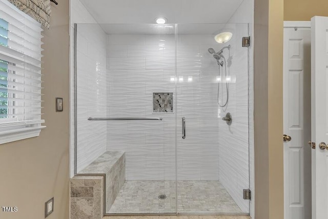 bathroom featuring a shower stall