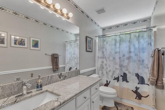 full bath with vanity and toilet