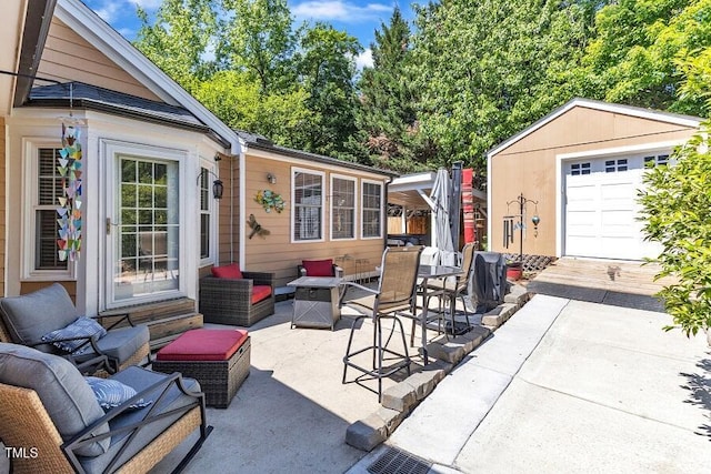 view of patio with an outdoor structure and outdoor lounge area