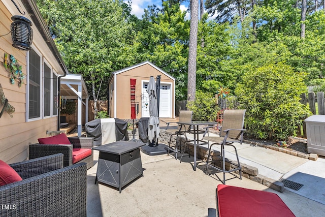 view of patio featuring a storage shed, grilling area, a fenced backyard, an outbuilding, and view of scattered trees