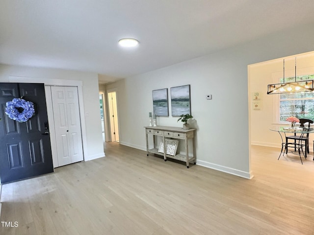 116 Lumpkin St, Raleigh, NC 27610 - foyer entrance with light wood-style flooring and baseboards