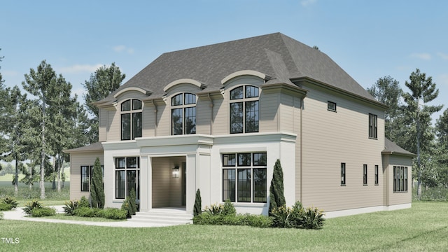 french country style house featuring a front lawn and a shingled roof