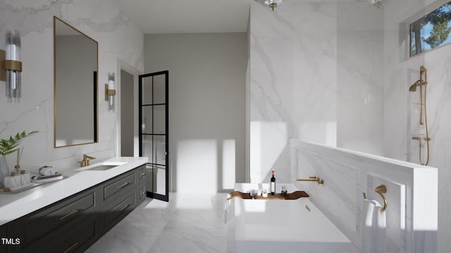 bathroom featuring marble tiled floors, a marble finish shower, vanity, and a freestanding bath