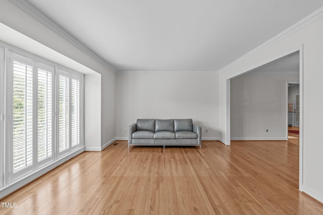 4830 N Hls, Raleigh, NC 27612 - living area with light wood-style floors, crown molding, and baseboards