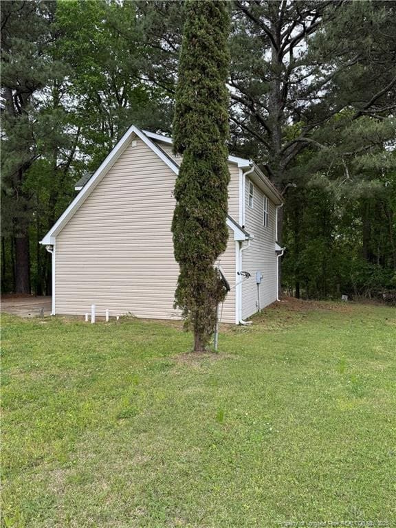 view of home's exterior featuring a yard