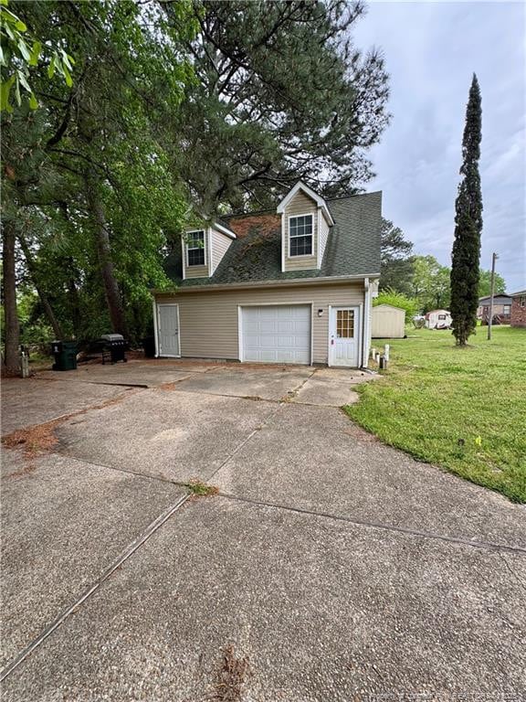 garage with concrete driveway