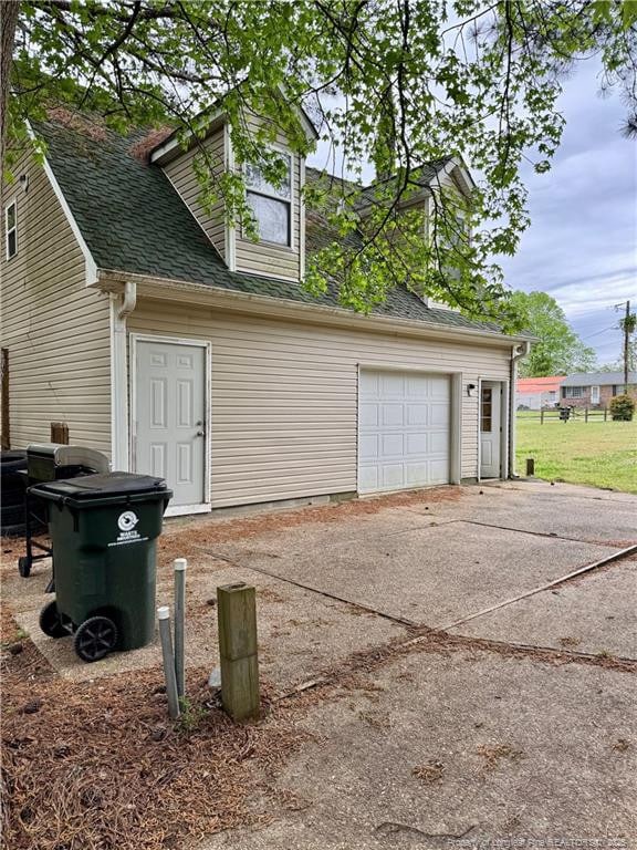 garage featuring driveway