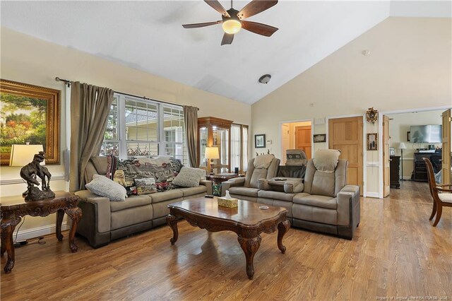5201 Flynn Dr, Lumberton, NC 28360 - living area featuring ceiling fan, high vaulted ceiling, light wood-style floors, and baseboards