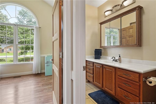 5201 Flynn Dr, Lumberton, NC 28360 - bathroom featuring plenty of natural light, vanity, and wood finished floors