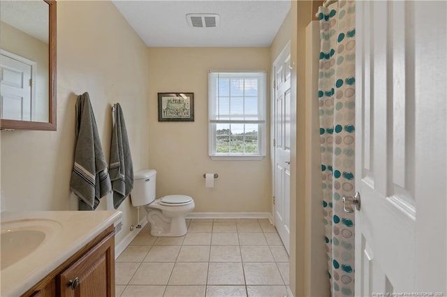 5201 Flynn Dr, Lumberton, NC 28360 - bathroom featuring toilet, baseboards, vanity, tile patterned floors, and a shower with curtain
